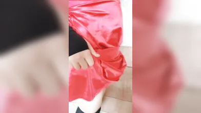 Crossdresser in Red Mini Dress Shows Off Legs & Thighs in Bedroom Tease